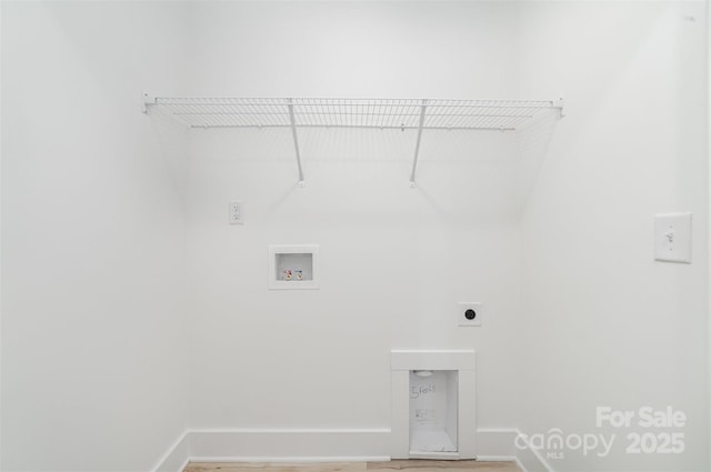 laundry room featuring baseboards, hookup for an electric dryer, hookup for a washing machine, and light wood-type flooring