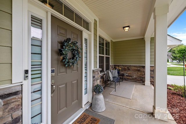 20307 Creek Bend Edge Ct Unit 10, Matthews, NC 28105 - view of exterior entry featuring a porch and stone siding