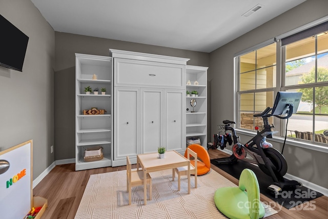 20307 Creek Bend Edge Ct Unit 10, Matthews, NC 28105 - exercise area with baseboards and wood finished floors