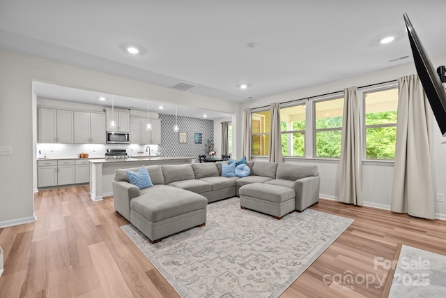 20307 Creek Bend Edge Ct Unit 10, Matthews, NC 28105 - living room featuring light wood-style flooring and recessed lighting
