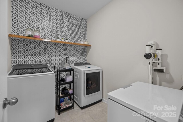 20307 Creek Bend Edge Ct Unit 10, Matthews, NC 28105 - laundry area with washer and clothes dryer, an accent wall, and light tile patterned floors