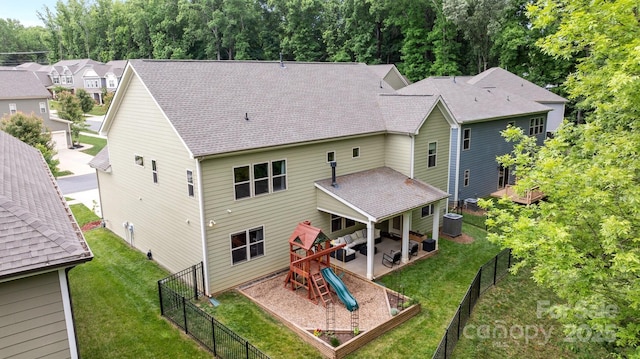 20307 Creek Bend Edge Ct Unit 10, Matthews, NC 28105 - rear view of house featuring a patio area, a fenced backyard, a playground, and roof with shingles