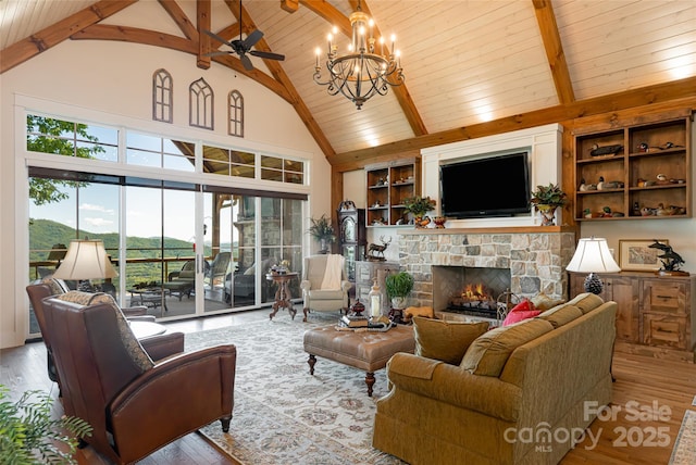 442 Signature Row Blvd, Waynesville, NC 28785 - living area featuring a stone fireplace, wood ceiling with exposed beams, high vaulted ceiling, hardwood / wood-style flooring, and built in shelves