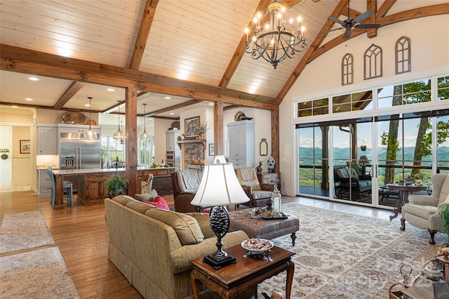 442 Signature Row Blvd, Waynesville, NC 28785 - living area featuring a chandelier, plenty of natural light, ceiling fan, high vaulted ceiling, and light wood finished floors