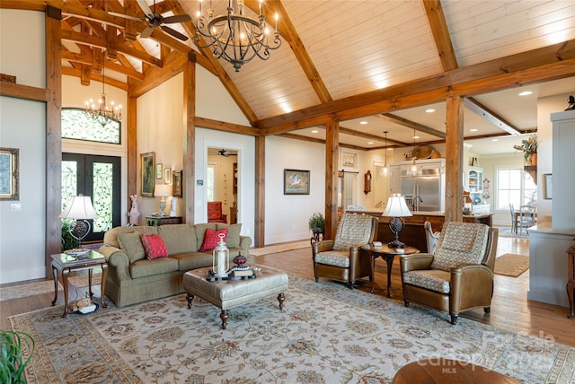 442 Signature Row Blvd, Waynesville, NC 28785 - living area with a chandelier, baseboards, beamed ceiling, wood finished floors, and a ceiling fan