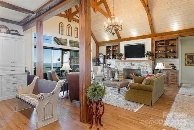442 Signature Row Blvd, Waynesville, NC 28785 - living area featuring a chandelier, a stone fireplace, light wood finished floors, and built in shelves