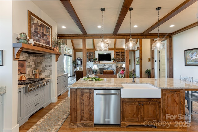 442 Signature Row Blvd, Waynesville, NC 28785 - kitchen with a sink, open floor plan, appliances with stainless steel finishes, wood finished floors, and decorative backsplash