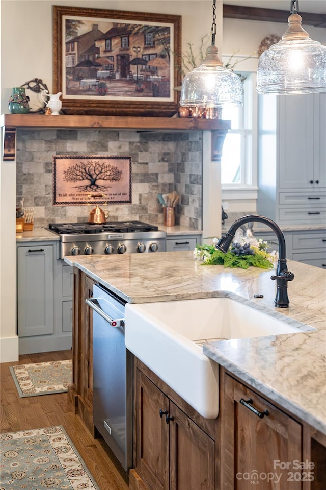 442 Signature Row Blvd, Waynesville, NC 28785 - kitchen with a sink, pendant lighting, appliances with stainless steel finishes, and light stone counters