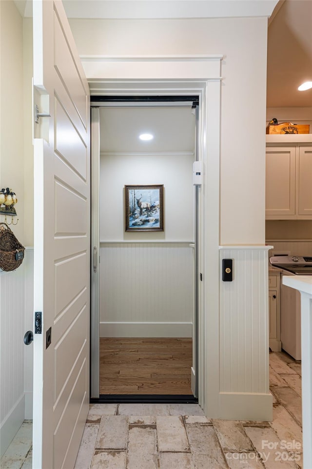 442 Signature Row Blvd, Waynesville, NC 28785 - detailed view of wainscoting, elevator, and wood finished floors