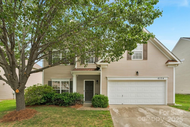 6104 Follow The Trl, Indian Trail, NC 28079 - traditional home with concrete driveway, a garage, and a front yard
