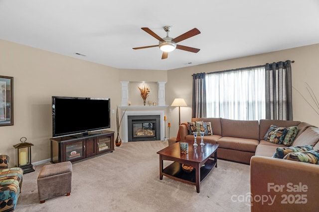 6104 Follow The Trl, Indian Trail, NC 28079 - living area featuring a ceiling fan, carpet, and a glass covered fireplace