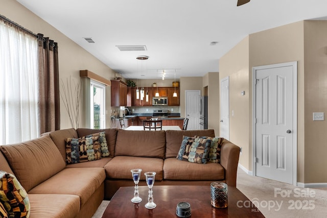 6104 Follow The Trl, Indian Trail, NC 28079 - living area with baseboards, light colored carpet, and ceiling fan