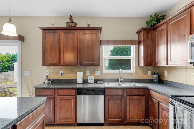6104 Follow The Trl, Indian Trail, NC 28079 - kitchen with stainless steel dishwasher, a sink, dark countertops, and backsplash