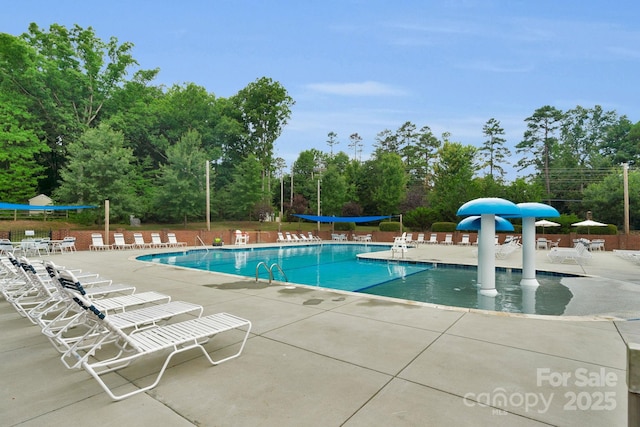 6104 Follow The Trl, Indian Trail, NC 28079 - community pool with a patio area and view of wooded area