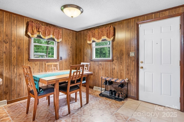 2401 Hillside Dr, Newton, NC 28658 - dining space featuring a textured ceiling and wooden walls