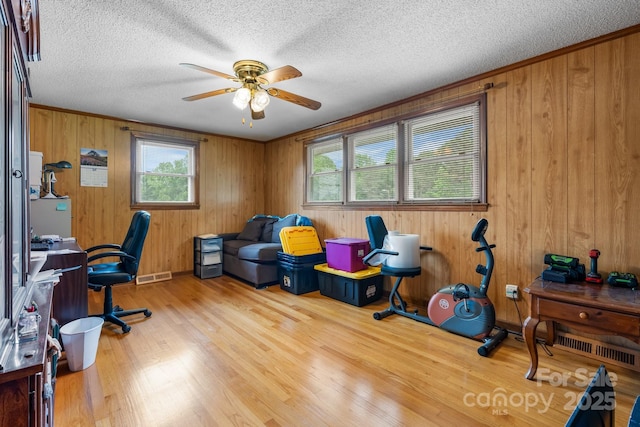 2401 Hillside Dr, Newton, NC 28658 - office area with a ceiling fan, wood finished floors, a textured ceiling, and wooden walls