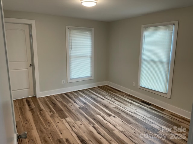 216 N Vance St, Gastonia, NC 28052 - spare room with wood finished floors and baseboards