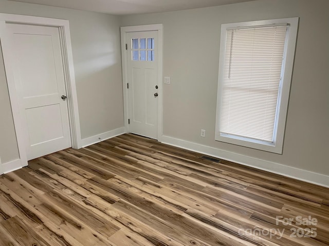 216 N Vance St, Gastonia, NC 28052 - foyer featuring wood finished floors and baseboards