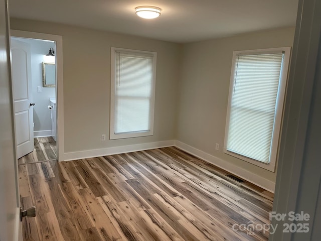 216 N Vance St, Gastonia, NC 28052 - empty room with wood finished floors and baseboards