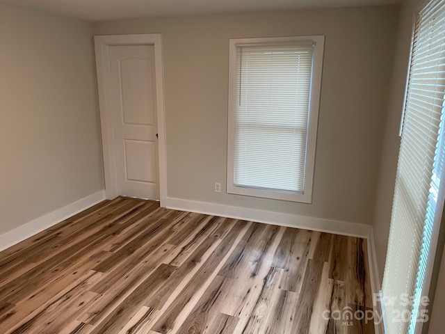 216 N Vance St, Gastonia, NC 28052 - empty room featuring baseboards and wood finished floors