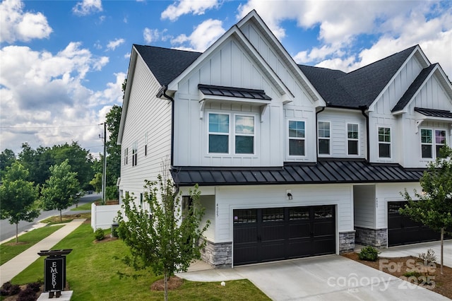 4005 Easton Ridge Ln, Charlotte, NC 28226 - modern inspired farmhouse with a standing seam roof, board and batten siding, a shingled roof, and an attached garage