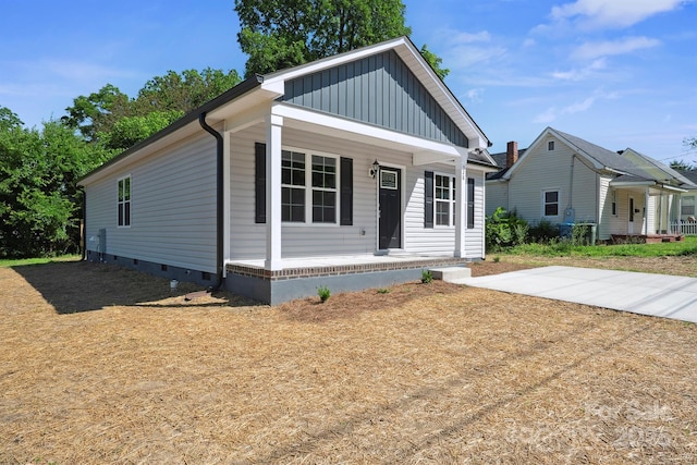 528 S Caldwell St, Salisbury, NC 28144 - view of front of home with a porch, board and batten siding, and crawl space