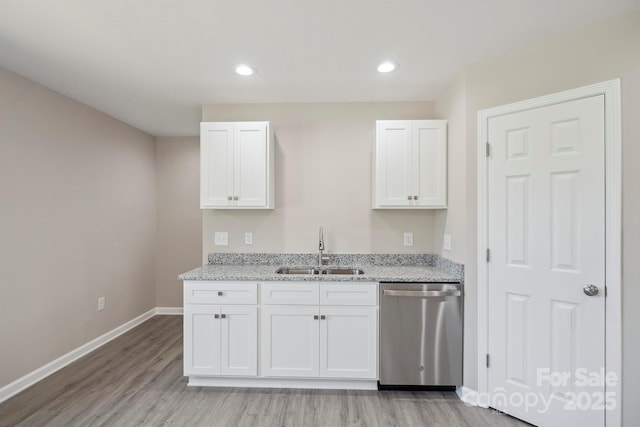 528 S Caldwell St, Salisbury, NC 28144 - kitchen featuring stainless steel dishwasher, light wood-type flooring, white cabinetry, light stone countertops, and recessed lighting