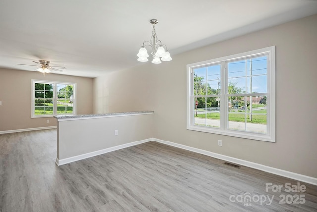 528 S Caldwell St, Salisbury, NC 28144 - empty room with a chandelier, wood finished floors, and ceiling fan