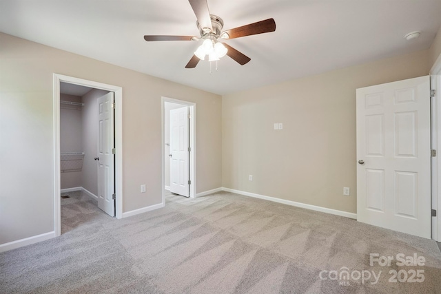 528 S Caldwell St, Salisbury, NC 28144 - unfurnished bedroom featuring carpet flooring, a walk in closet, a ceiling fan, and a closet