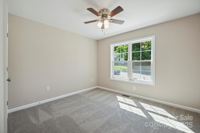 528 S Caldwell St, Salisbury, NC 28144 - carpeted empty room with baseboards and a ceiling fan