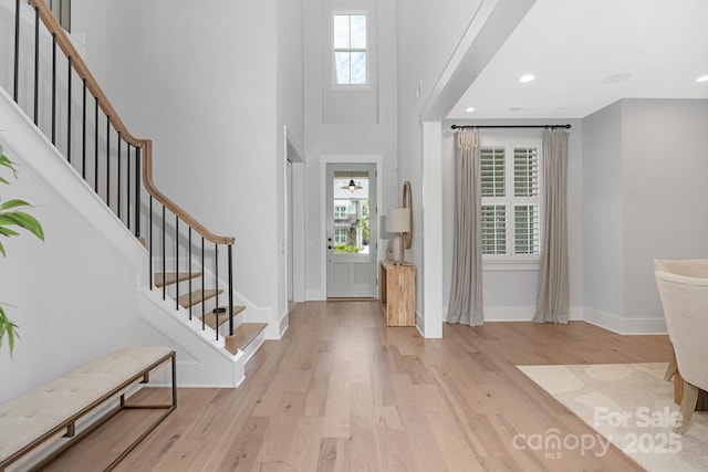 2026 Thatcher Way, Fort Mill, SC 29715 - entryway featuring plenty of natural light, wood finished floors, baseboards, stairs, and a high ceiling