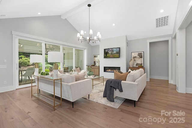 2026 Thatcher Way, Fort Mill, SC 29715 - living area featuring high vaulted ceiling, beam ceiling, a large fireplace, wood finished floors, and a chandelier