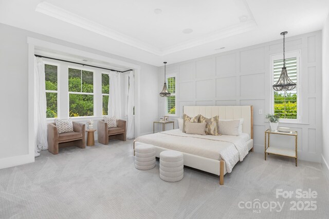 2026 Thatcher Way, Fort Mill, SC 29715 - bedroom with a decorative wall, a tray ceiling, carpet, and ornamental molding