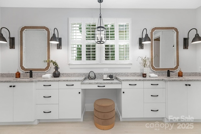 2026 Thatcher Way, Fort Mill, SC 29715 - bathroom featuring vanity, wood finished floors, and a chandelier