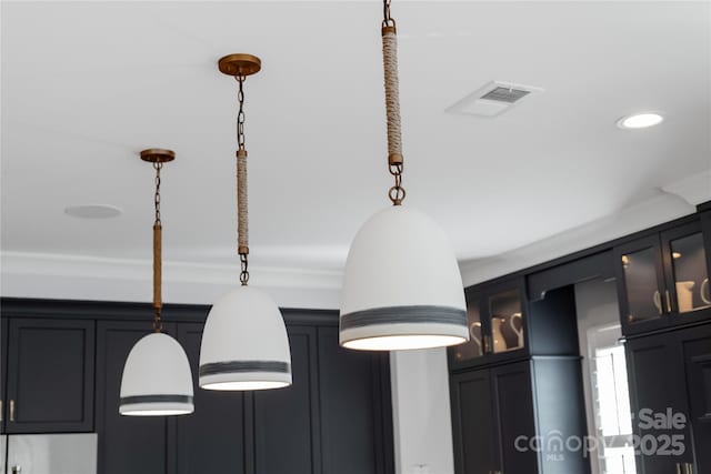 2026 Thatcher Way, Fort Mill, SC 29715 - kitchen view of pendant lighting, glass insert cabinets, recessed lighting, crown molding, and refrigerator
