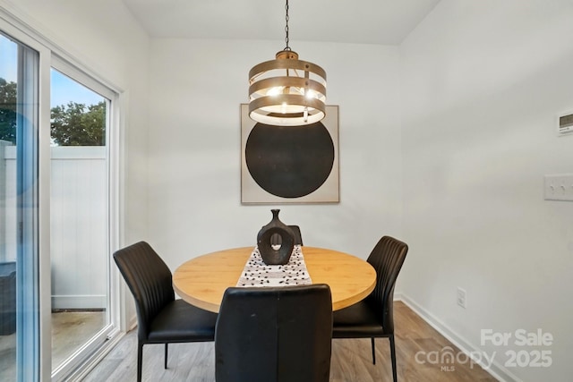 2018 Crooked Oak Ln, York, SC 29745 - dining space with wood finished floors, baseboards, and a chandelier
