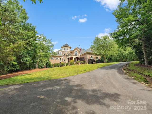 6742 Charlotte Hwy, York, SC 29745 - view of front facade featuring a balcony, a front yard, and stone siding