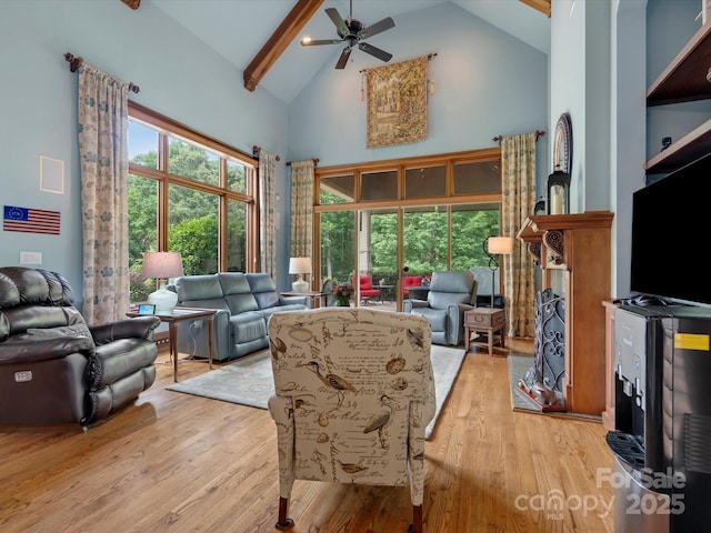 6742 Charlotte Hwy, York, SC 29745 - living room featuring high vaulted ceiling, wood finished floors, a ceiling fan, and beamed ceiling