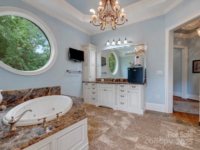 6742 Charlotte Hwy, York, SC 29745 - bathroom featuring a chandelier, vanity, ornamental molding, a tub with jets, and a tray ceiling