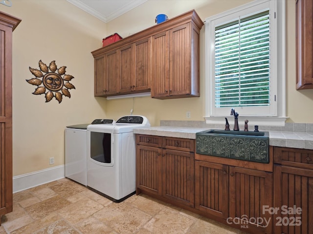 6742 Charlotte Hwy, York, SC 29745 - laundry room featuring cabinet space, crown molding, independent washer and dryer, stone tile flooring, and baseboards