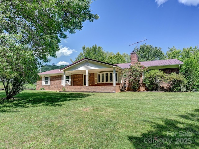 522 Bailey Mountain Rd, Mars Hill, NC 28754 - single story home featuring a chimney, a front lawn, brick siding, and a porch