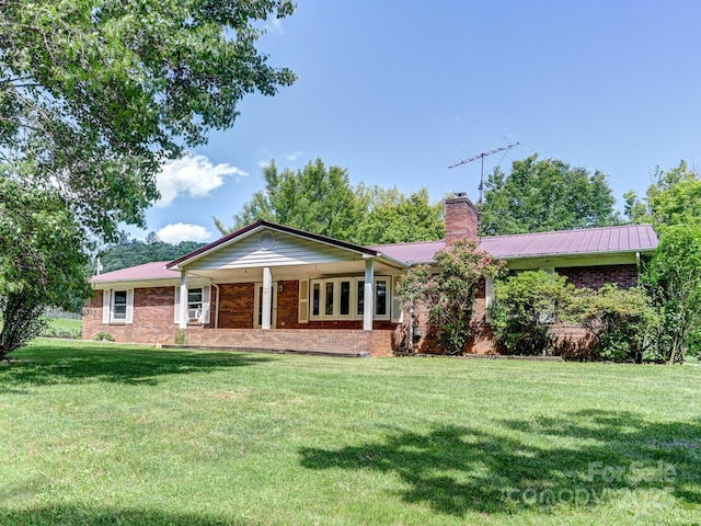 522 Bailey Mountain Rd, Mars Hill, NC 28754 - ranch-style house featuring a chimney, a front yard, brick siding, and metal roof