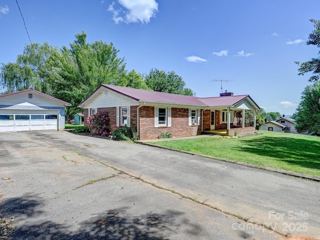 522 Bailey Mountain Rd, Mars Hill, NC 28754 - ranch-style home with brick siding, an outdoor structure, a chimney, metal roof, and a garage