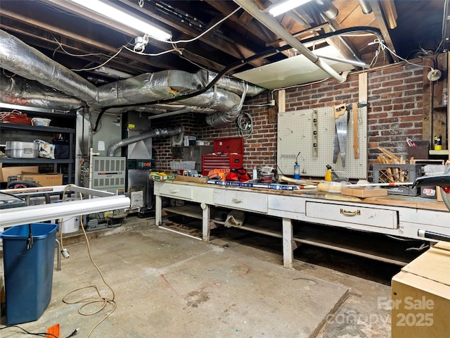 6 Woodley Ave, Asheville, NC 28804 - unfinished basement with a workshop area and brick wall