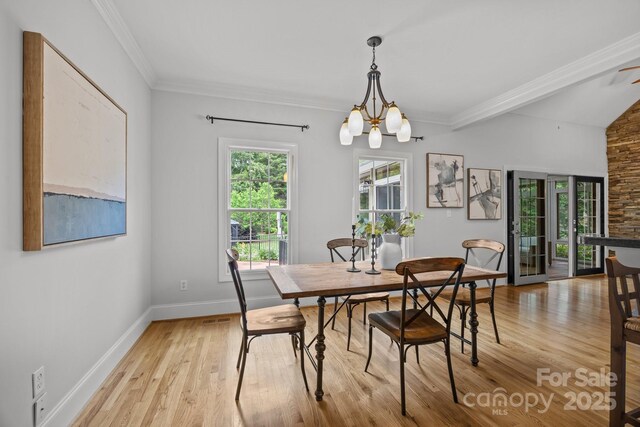 389 Ponderosa Cir, Mooresville, NC 28117 - dining room featuring light wood-style flooring, baseboards, ornamental molding, and a chandelier