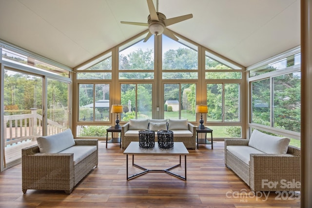 389 Ponderosa Cir, Mooresville, NC 28117 - sunroom featuring healthy amount of natural light, vaulted ceiling, a wall of windows, a wooden deck, and wood finished floors