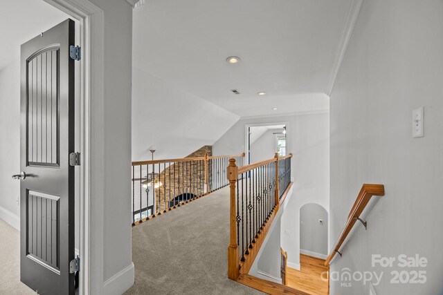 389 Ponderosa Cir, Mooresville, NC 28117 - hallway with an upstairs landing, ornamental molding, baseboards, recessed lighting, and vaulted ceiling