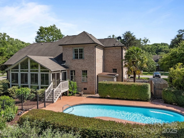 389 Ponderosa Cir, Mooresville, NC 28117 - rear view of house with a sunroom, brick siding, stairs, a shingled roof, and a patio area
