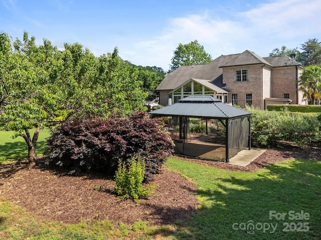 389 Ponderosa Cir, Mooresville, NC 28117 - rear view of property featuring a gazebo and a yard