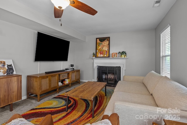 10327 Shelter Rock Ct, Charlotte, NC 28214 - carpeted living room with a fireplace, a ceiling fan, and baseboards